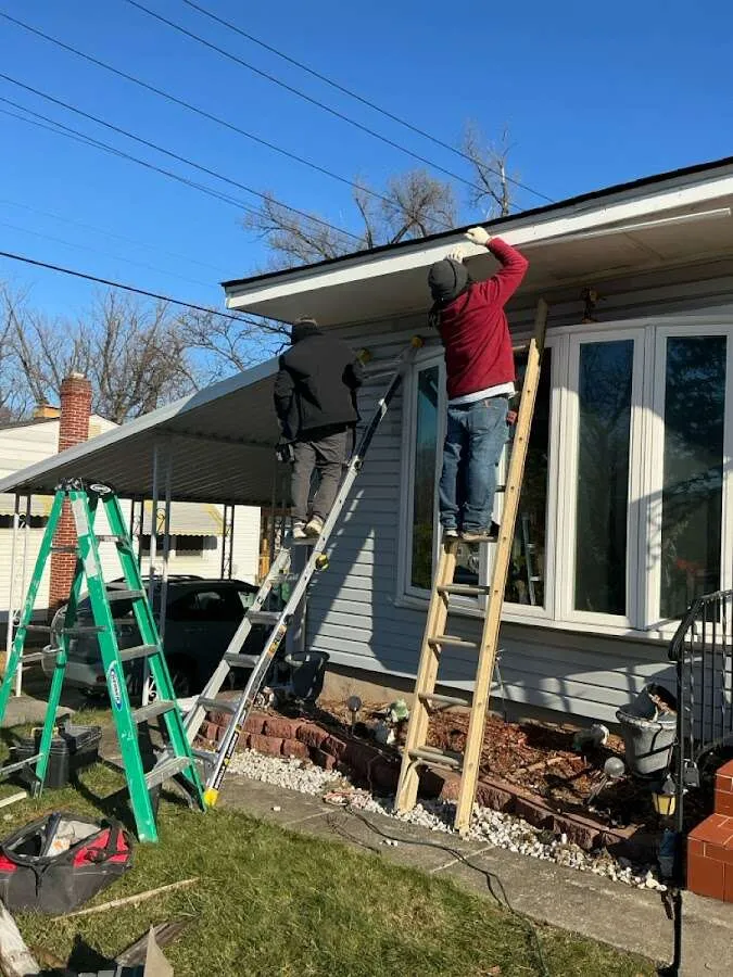 Restoration crew performing exterior repair in South Run